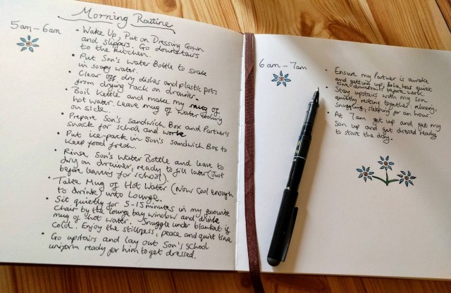 A handwritten outline of the author Clare's morning routine. One page shows the routine between 5am-6am. The next page shows the routine between 6am -7am. It is all written in a leather bound notebook and decorated with colourful hand drawn flowers. This shows the process the author went through to settle on her calming morning routine. All the information contained in the handwritten note in this phtoto is also outlined in the main text of Clare's blog post.