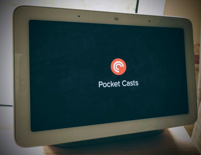 A Google Home Screen showing the logo for the Pocket Casts App. Pocket Casts is an app to play Podcasts on. This shows someone casting a Podcast to their Google Home speaker so they can listen while at home.